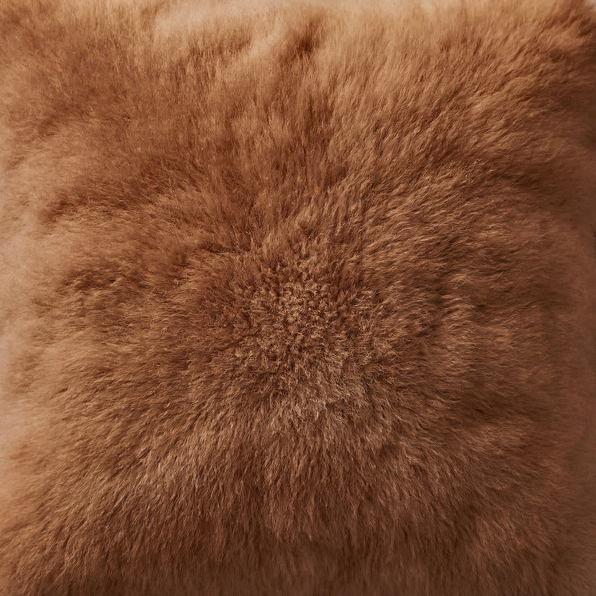 Close-up of chestnut baby alpaca fur showing its dense, soft texture and natural fiber direction
