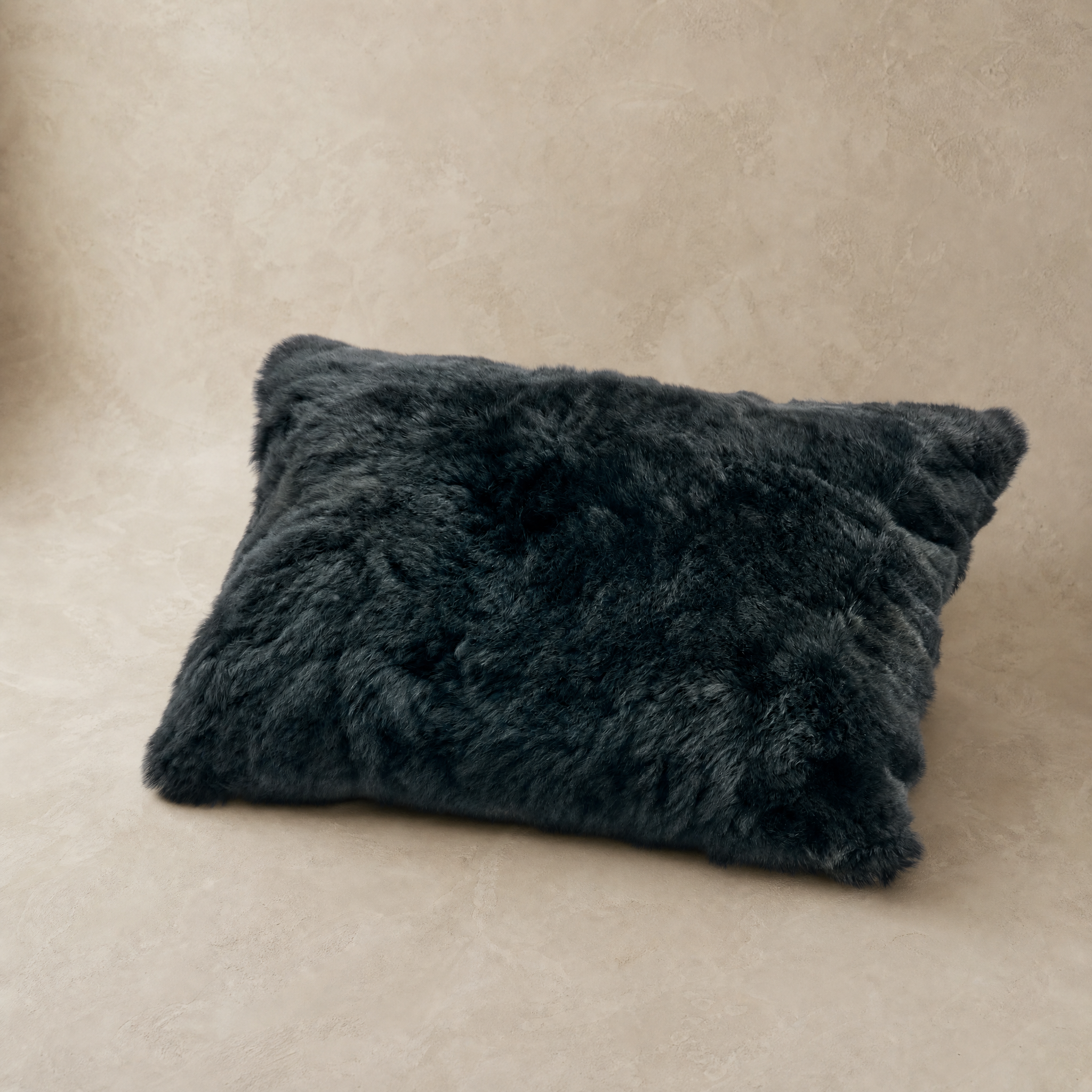 Black baby alpaca fur throw pillow, front view