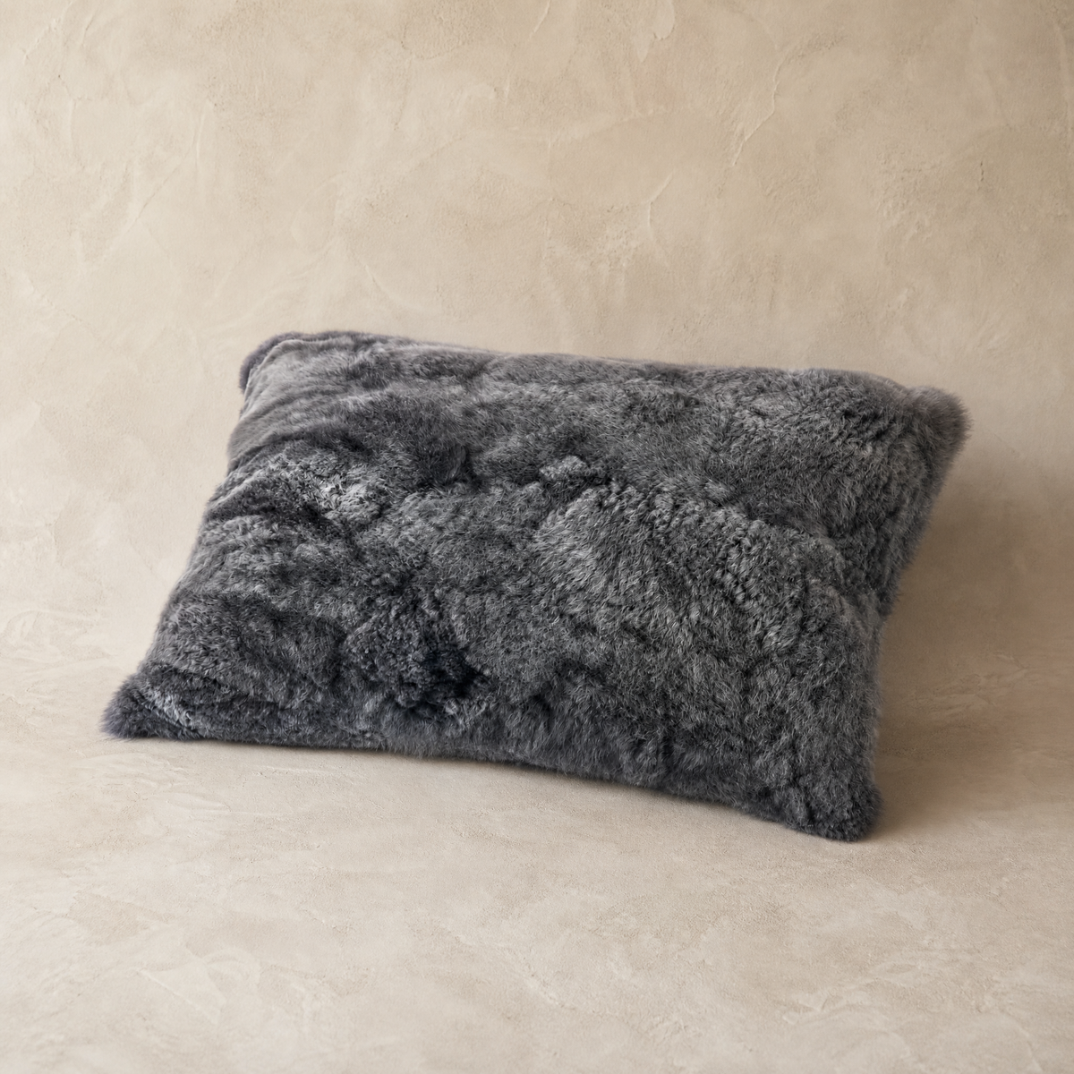 Dark gray baby alpaca fur throw pillow, front view
