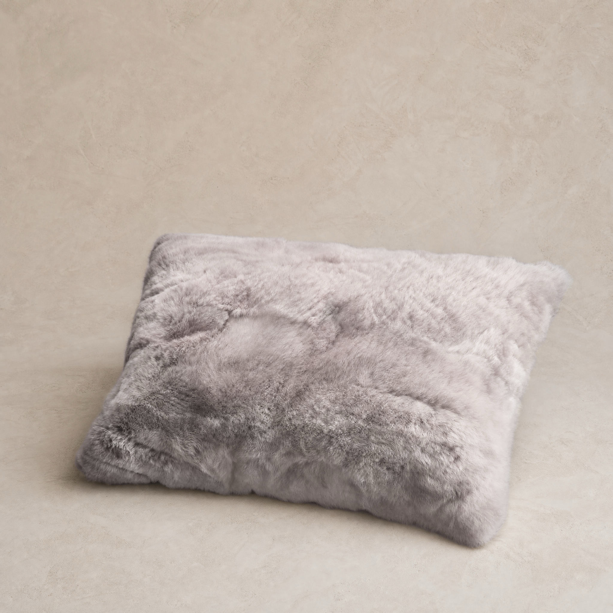 Light gray baby alpaca fur throw pillow, front view