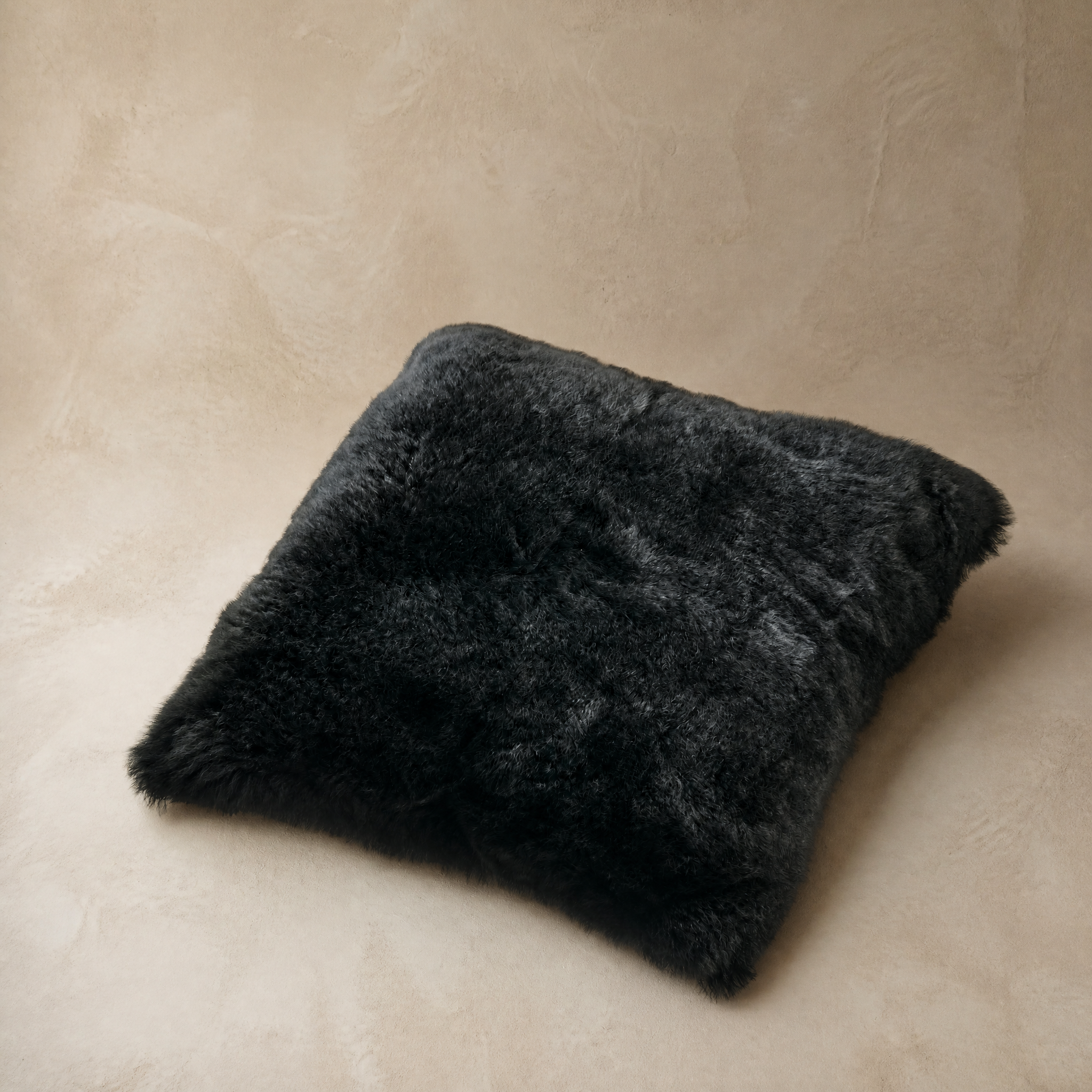 Black baby alpaca fur cushion – Alpaca Gold Standard