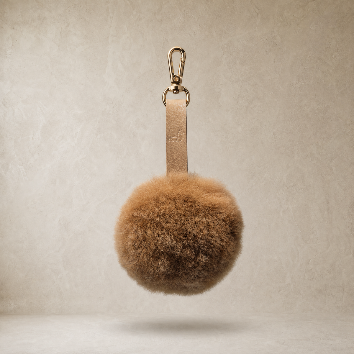 Chestnut soft baby alpaca fur pompon with leather strap and golden lobster clasp