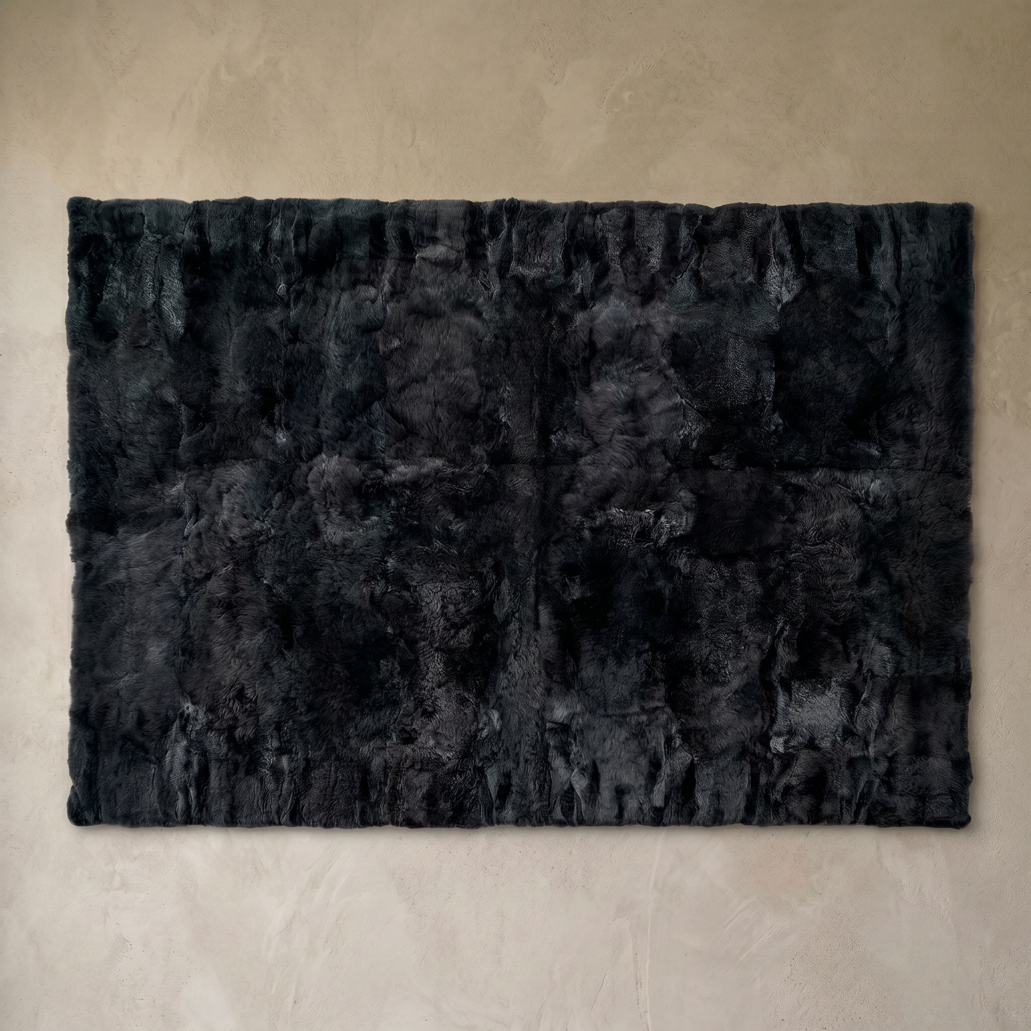 Black rectangular baby alpaca fur area rug