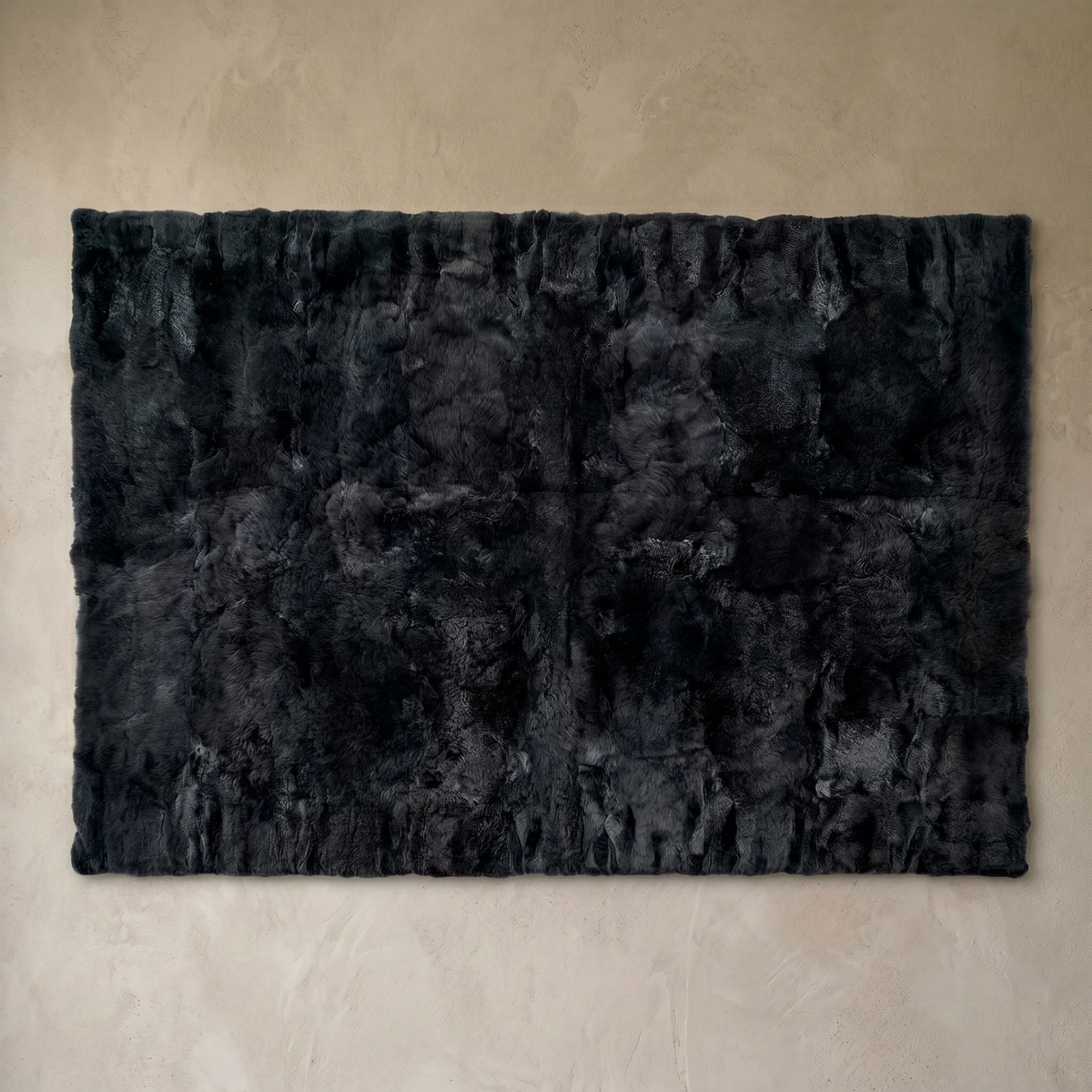 Black rectangular baby alpaca fur area rug