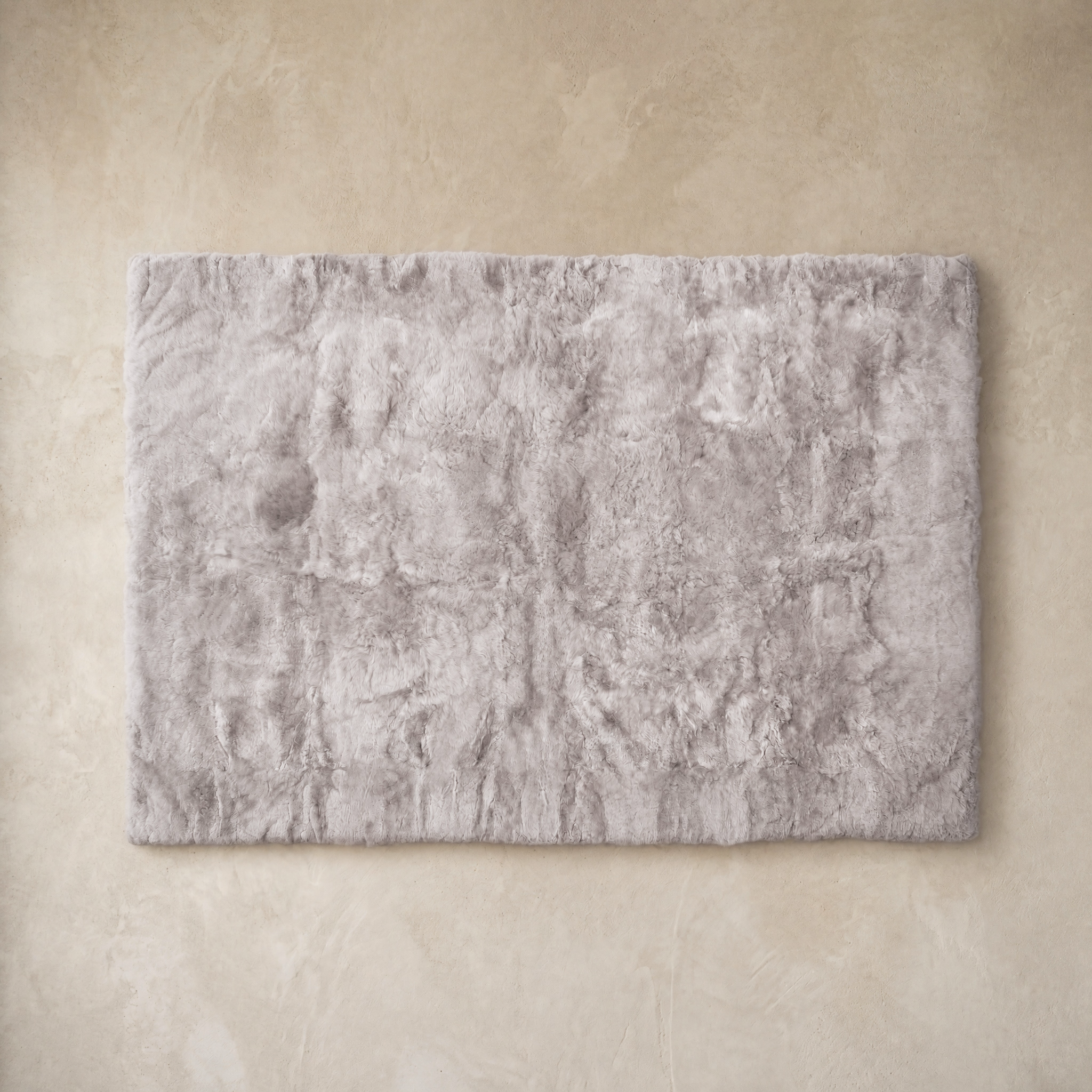 Light gray rectangular baby alpaca fur area rug