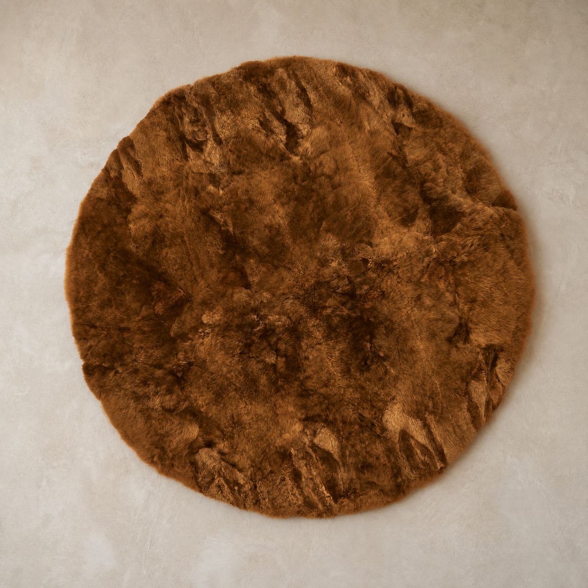 Chestnut round baby alpaca fur area rug